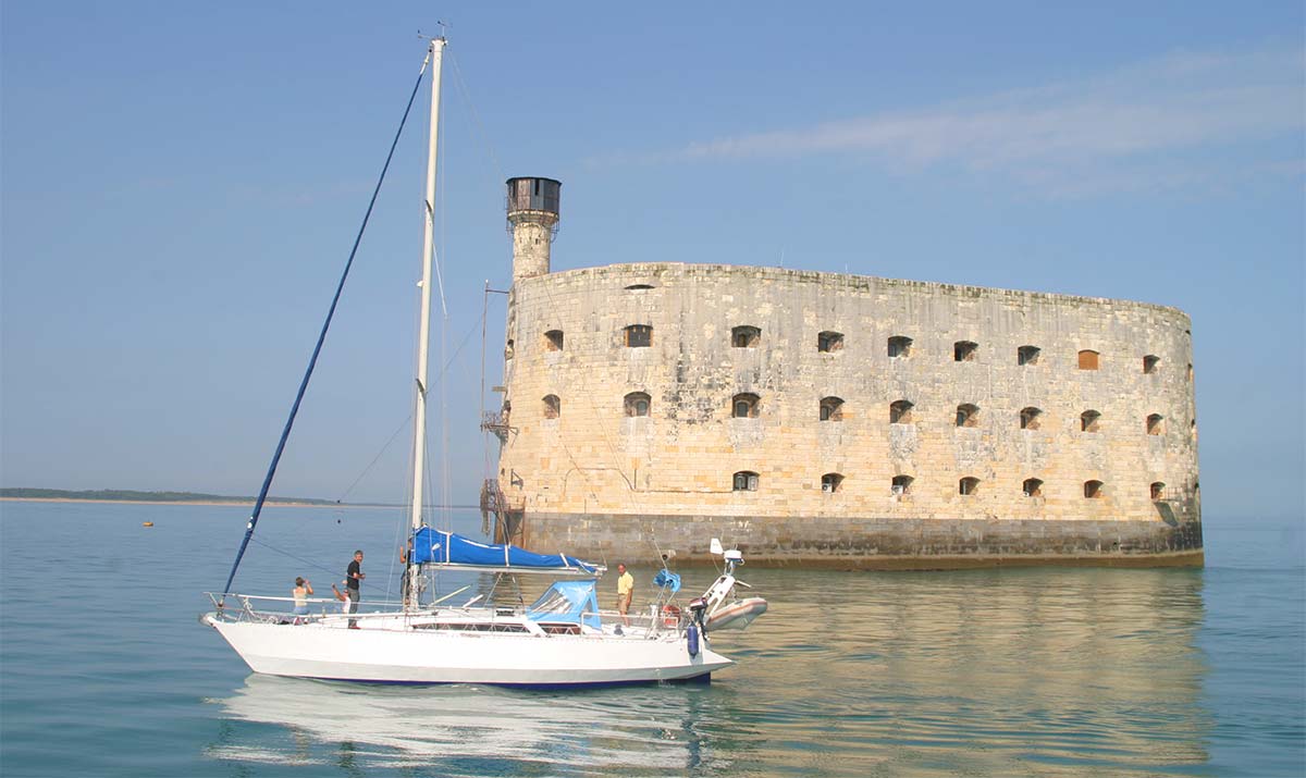 Sailboat sailing in front of Fort Boyard