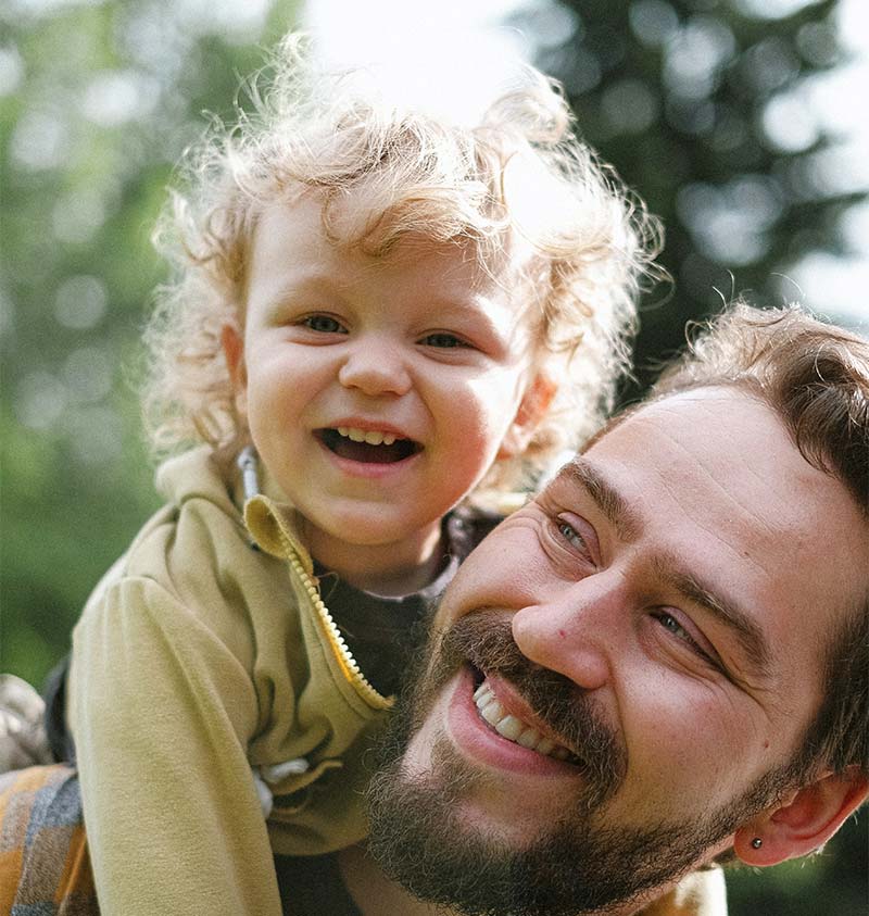 Little girl and her father in the campsite park in Oléron