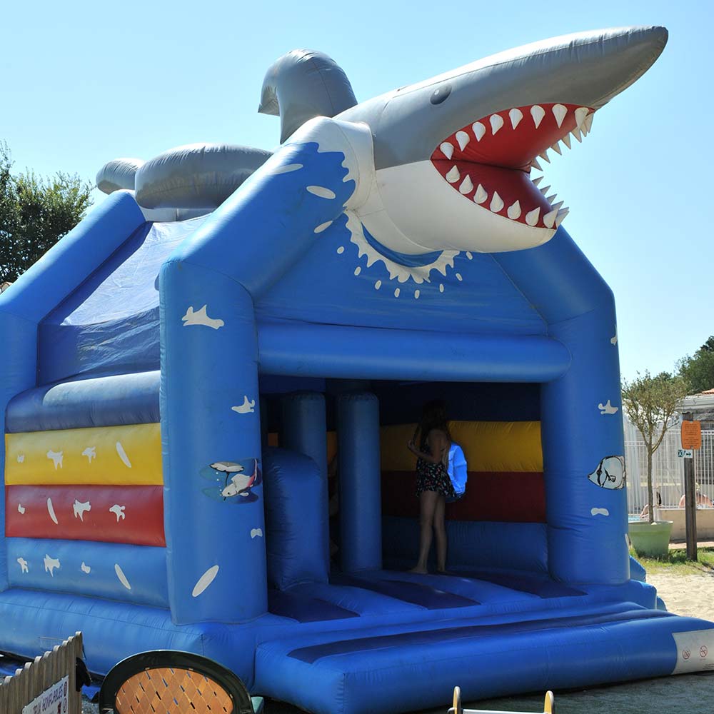 Inflatable game for children with a shark at the campsite in Oléron