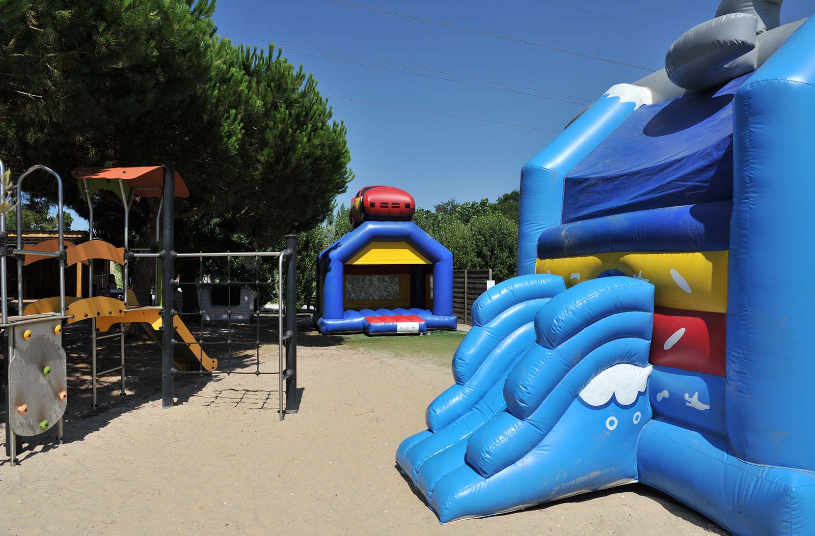 Inflatable play structures on the children's play area at the campsite in Oléron