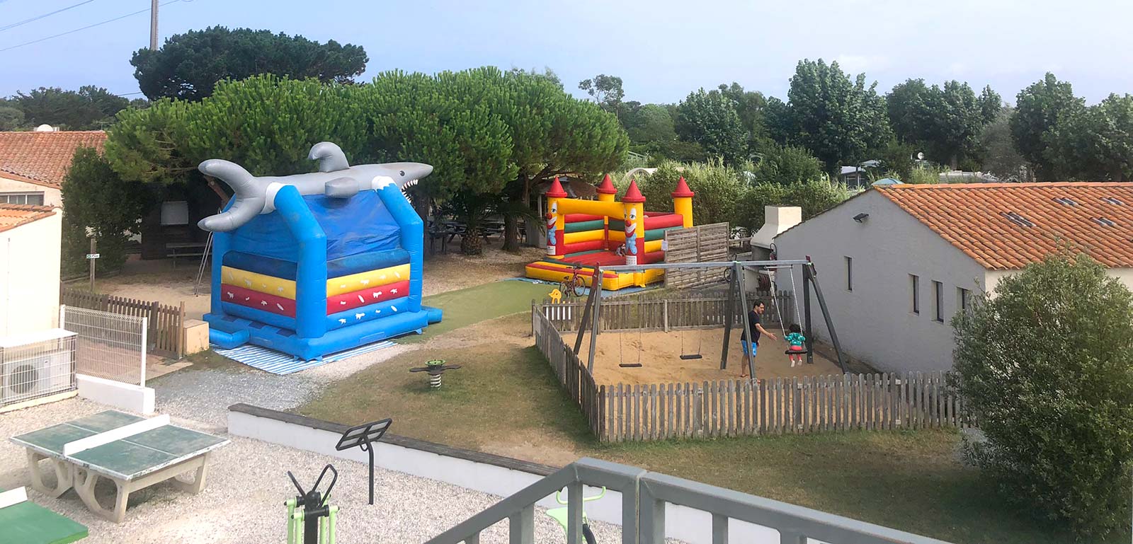 Inflatable play structures on the children's play area at the campsite in Oléron