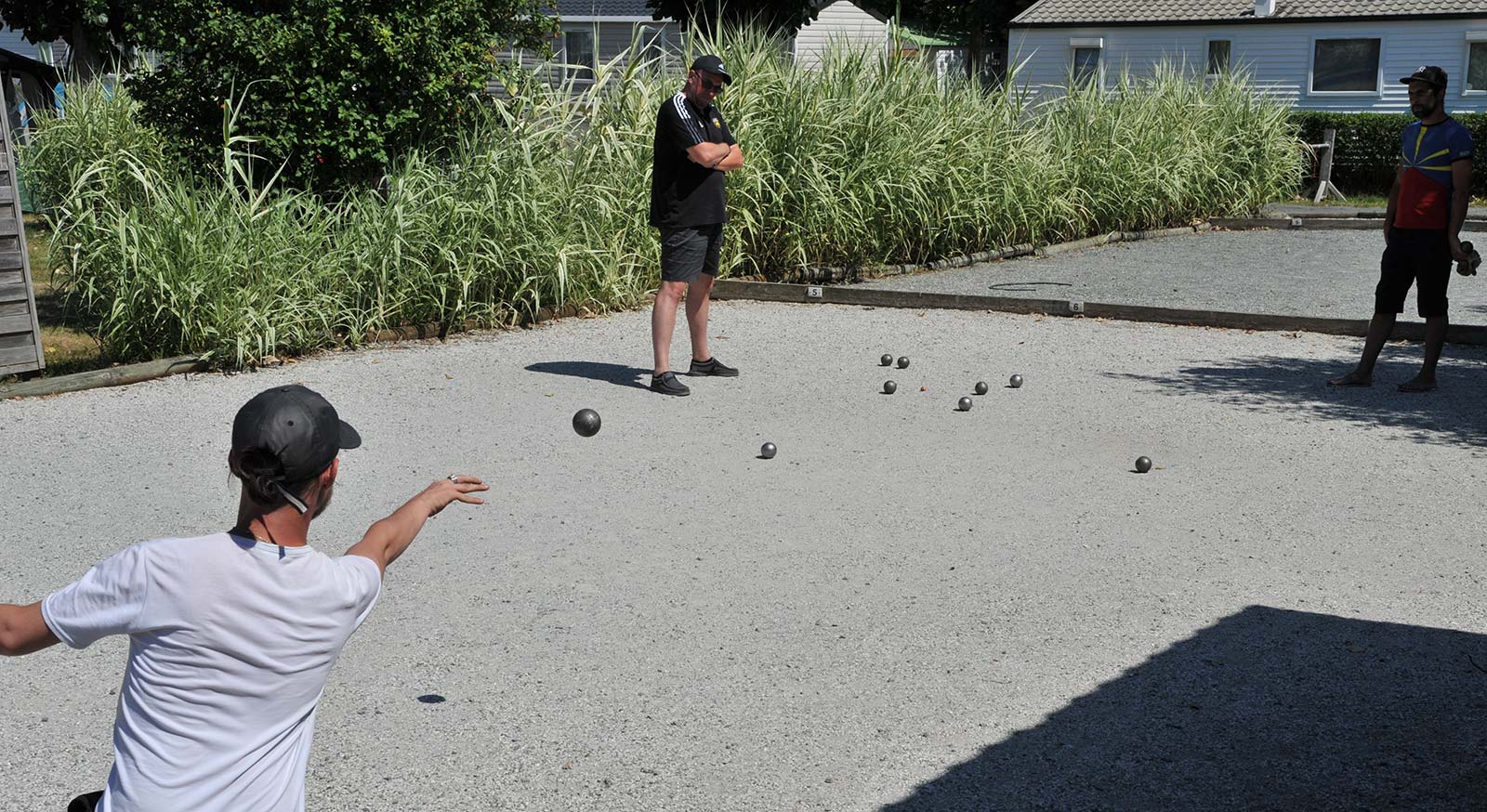 Pétanque players on the bowling alley at the campsite in Oléron