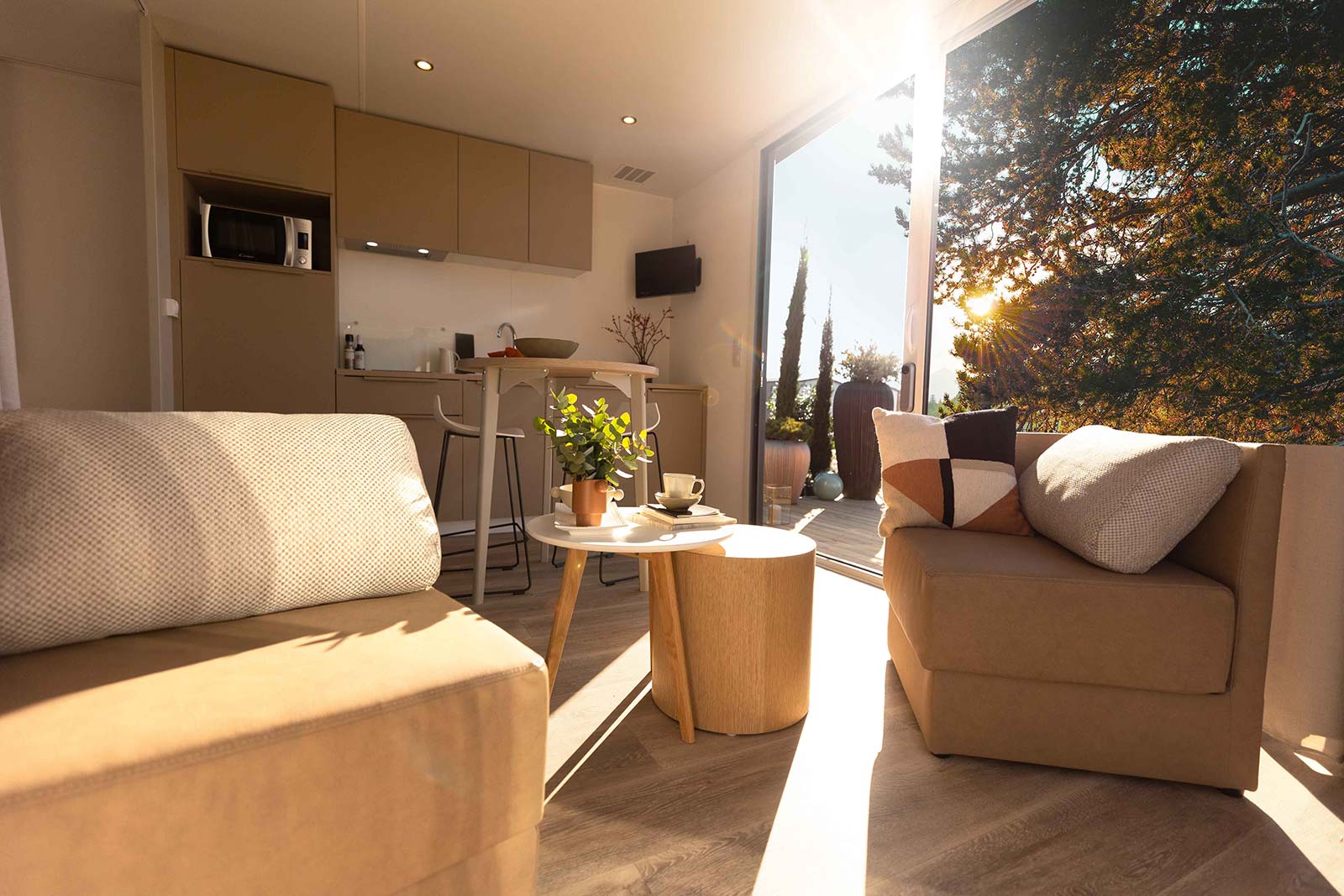 Bright living room of a mobile home to rent at the campsite in Oléron