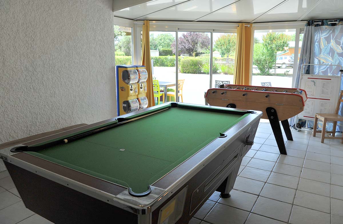 Billiards and table football in the games room at the campsite in Oléron