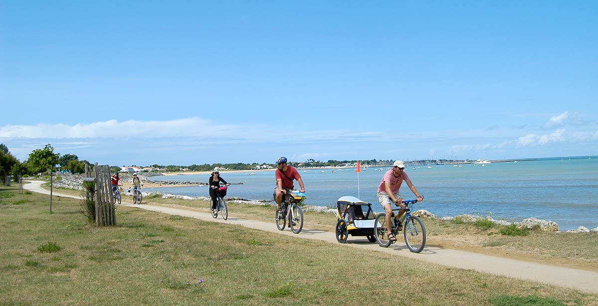 Cyclist on a cycle path by the sea in Oléron